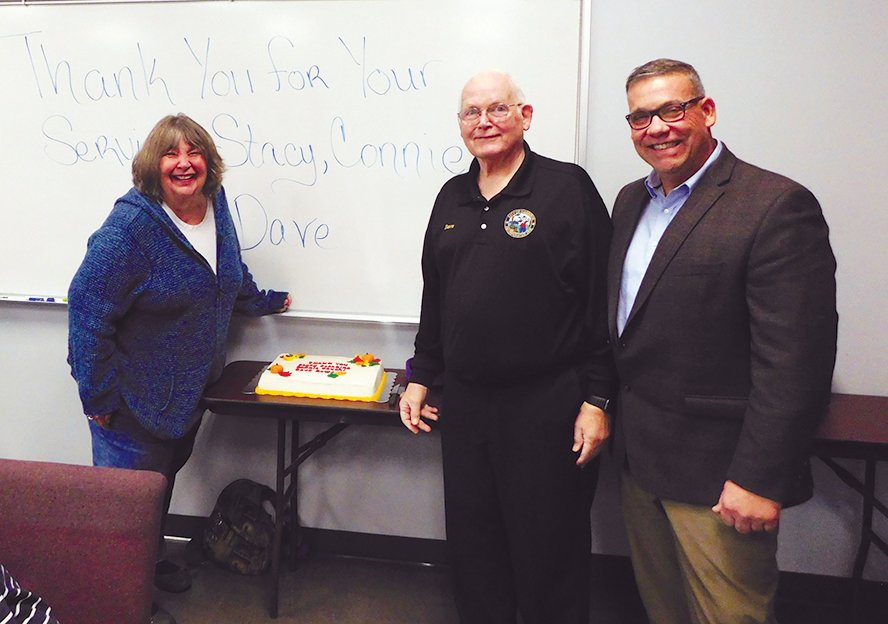 Connie Cauchi, Dave Rowe and Mayor Stacy Stocking at a luncheon held in their honor.